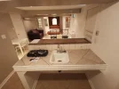 Basement kitchen + living room.webp