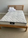 double size bed frame and mattress.webp
