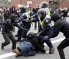 police-beating-a-rioter.jpg