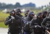 1771371-anti-terrorist-swat-commando-approaching-the-hijacker.jpg